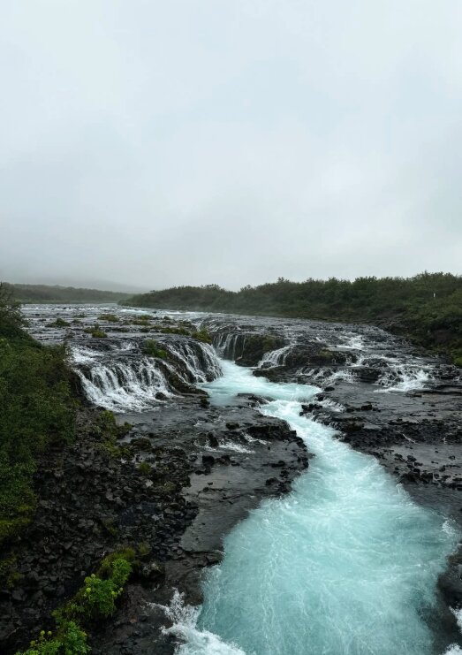 A Golden Circle waterfall framed by Icelandic landscape